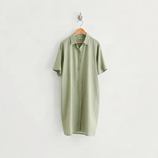 Baju digantung di dinding abu